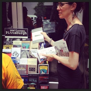 Karen Lillis selling books at her pop-up bookstand, Small Press Pittsburgh. Photo credit: Laura Zurowski